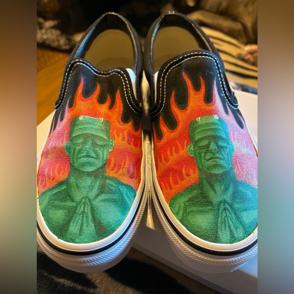 These are custom Classic Slip-on black vans Size 6 in men’s and 7.5/woman’s.